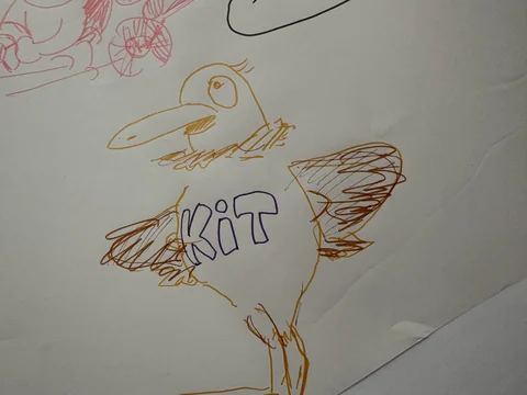 Hand-drawn bird illustration with the letters KIT