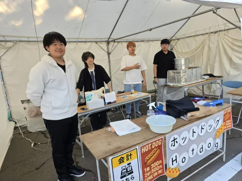 Students staffing a hot dog stall at the festival