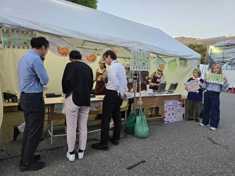 Visitors ordering food at a croffle stall